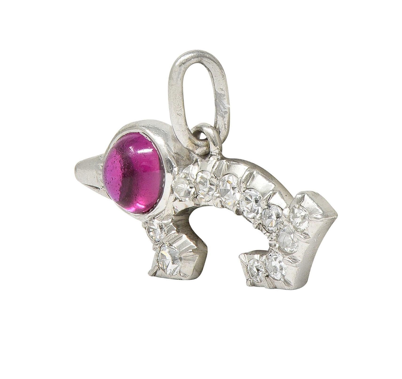 Designed as a stylized wiener dog with a round shaped ruby cabochon head
Weighing approximately 0.35 carat total - transparent medium red in color
Bezel set with single cut diamonds bead set on body
Weighing approximately 0.15 carat total 
Eye clean