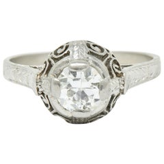 Anello di fidanzamento Art Deco da 0,52 carati con diamante in platino a forma di volute