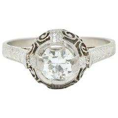 Bague de fiançailles Art déco en platine avec feuillage à volutes et diamants 0,52 carat