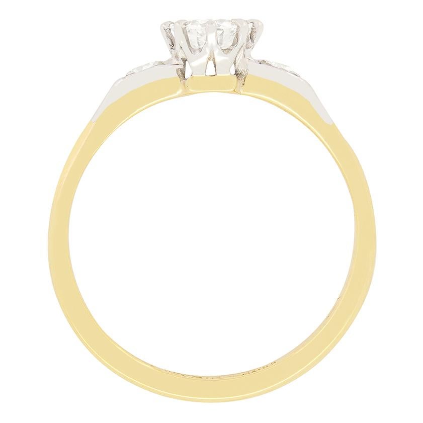 This elegant Art Deco solitaire ring features a delightful 0.54 carat transitional cut diamond at its heart. The diamond has a colour of I in colour and clarity of VS2 and is securely claw set into platinum. Enhancing the design, a 0.05 carat old