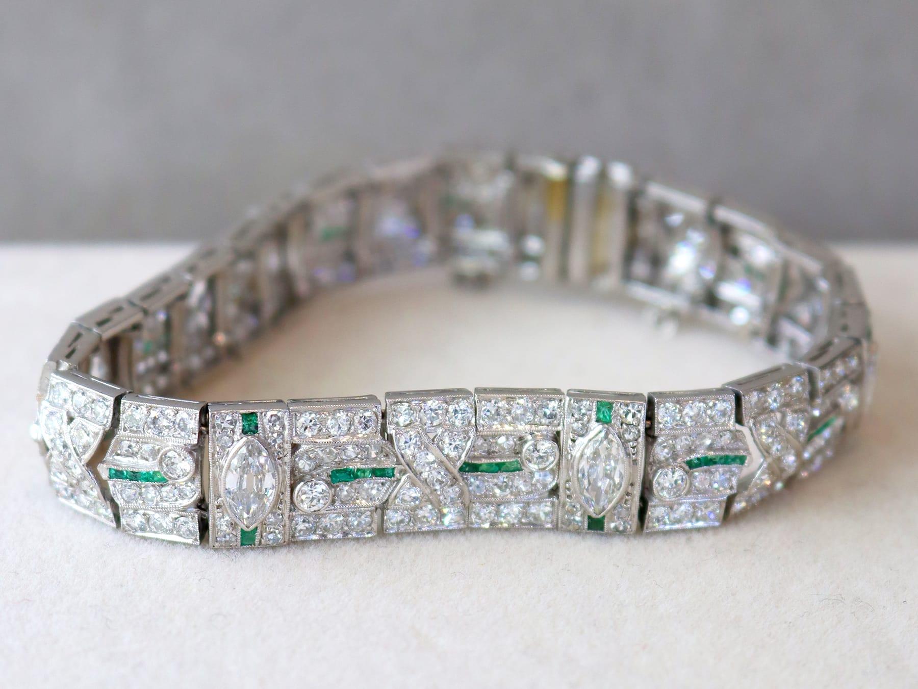 Baguette Cut Art Deco 0.60 Carat Emerald, 10.47 Carat Diamond Platinum Bracelet Circa 1925 For Sale
