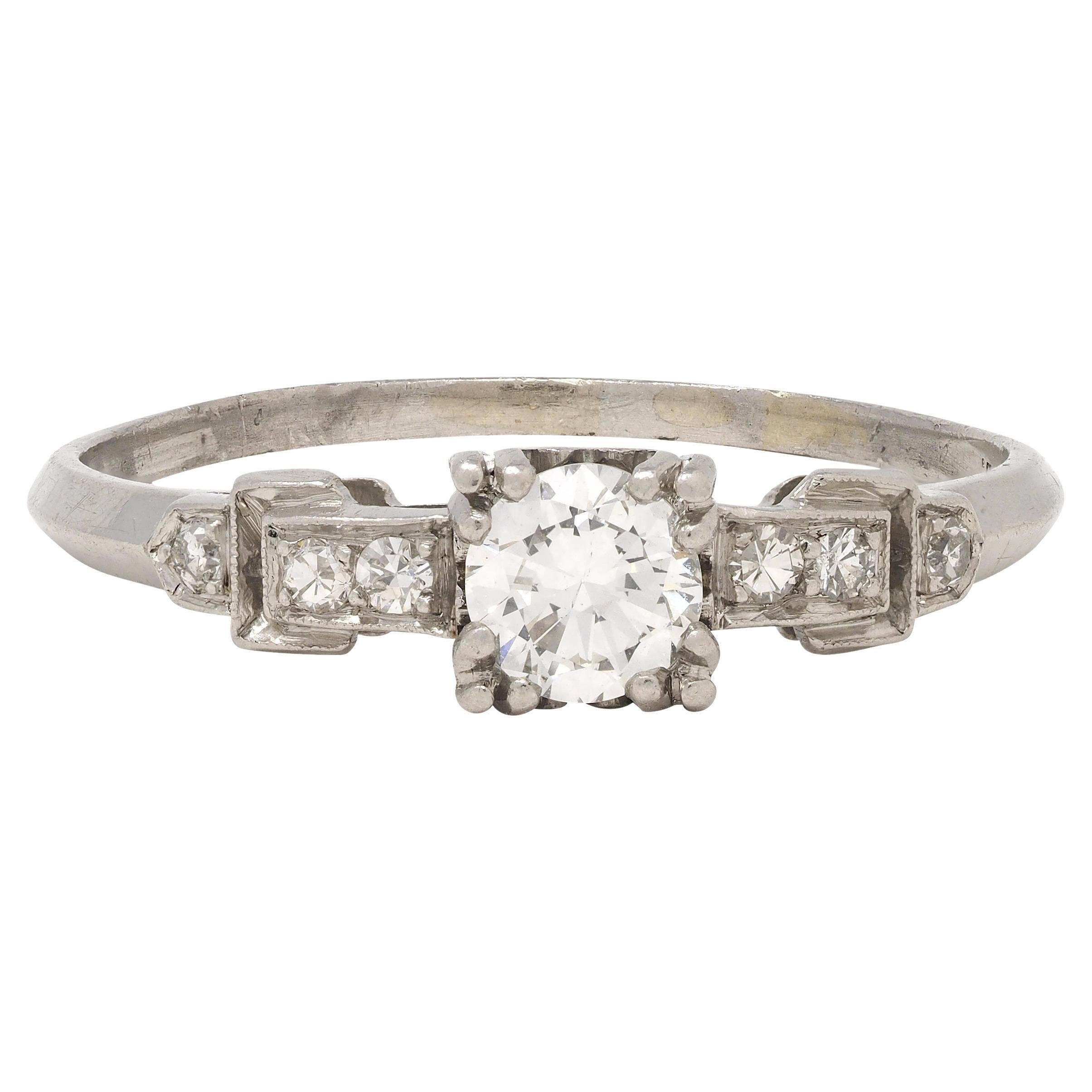 Art Deco 0.60 CTW Diamond Platinum Heart Buckle Vintage Engagement Ring For Sale