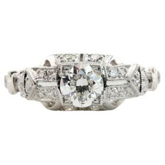 Antique Art Deco 0.64 CTW Diamond Engagement Ring in Platinum with Milgrain Detailing