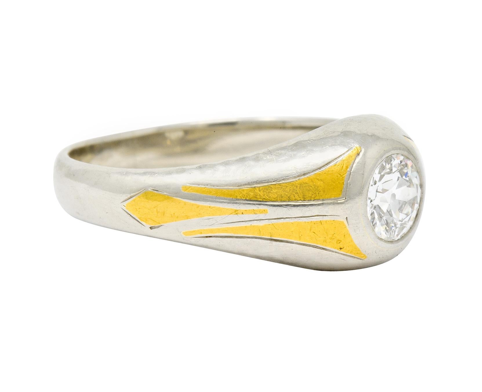 Centering an old European cut diamond weighing approximately 0.65 carats, G/H color with VS clarity

Bezel set low in mounting featuring geometric yellow gold inlay over hammered white gold

Tested as 14 karat gold 

Circa 1930's

Ring Size: 10 &