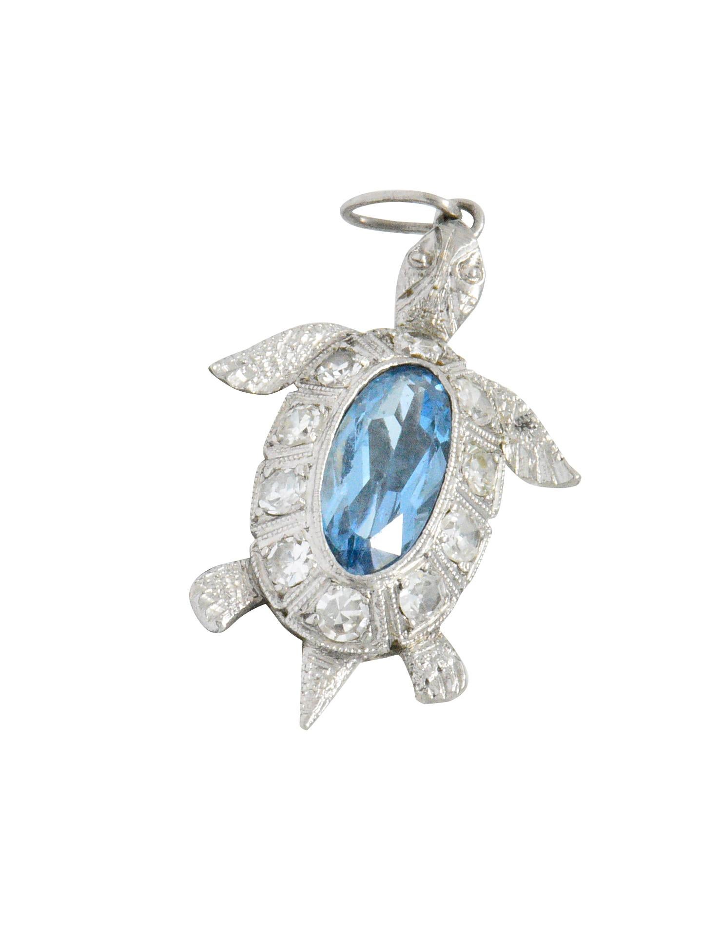 Designed as a sea turtle with an oval cut aquamarine shell weighing approximately 0.56 carat, bright light blue

With ten single cut diamonds around the shell weighing approximately 0.30 carat, eye-clean and white

Detailed engraving on head, feet