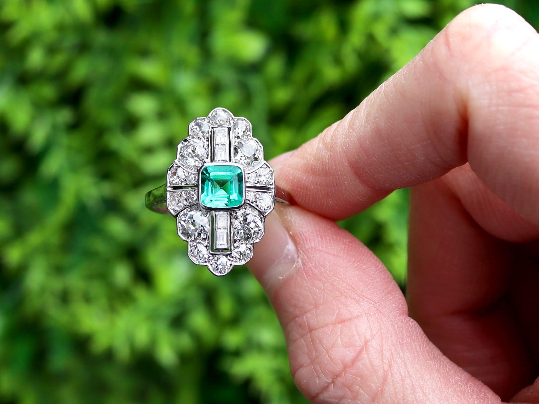 A stunning, fine and impressive antique Art Deco 0.70 carat emerald and 2.42 carat diamond, platinum navette shaped cluster dress ring; part of our diverse antique jewelry and estate jewelry collections.

This stunning, fine and impressive antique