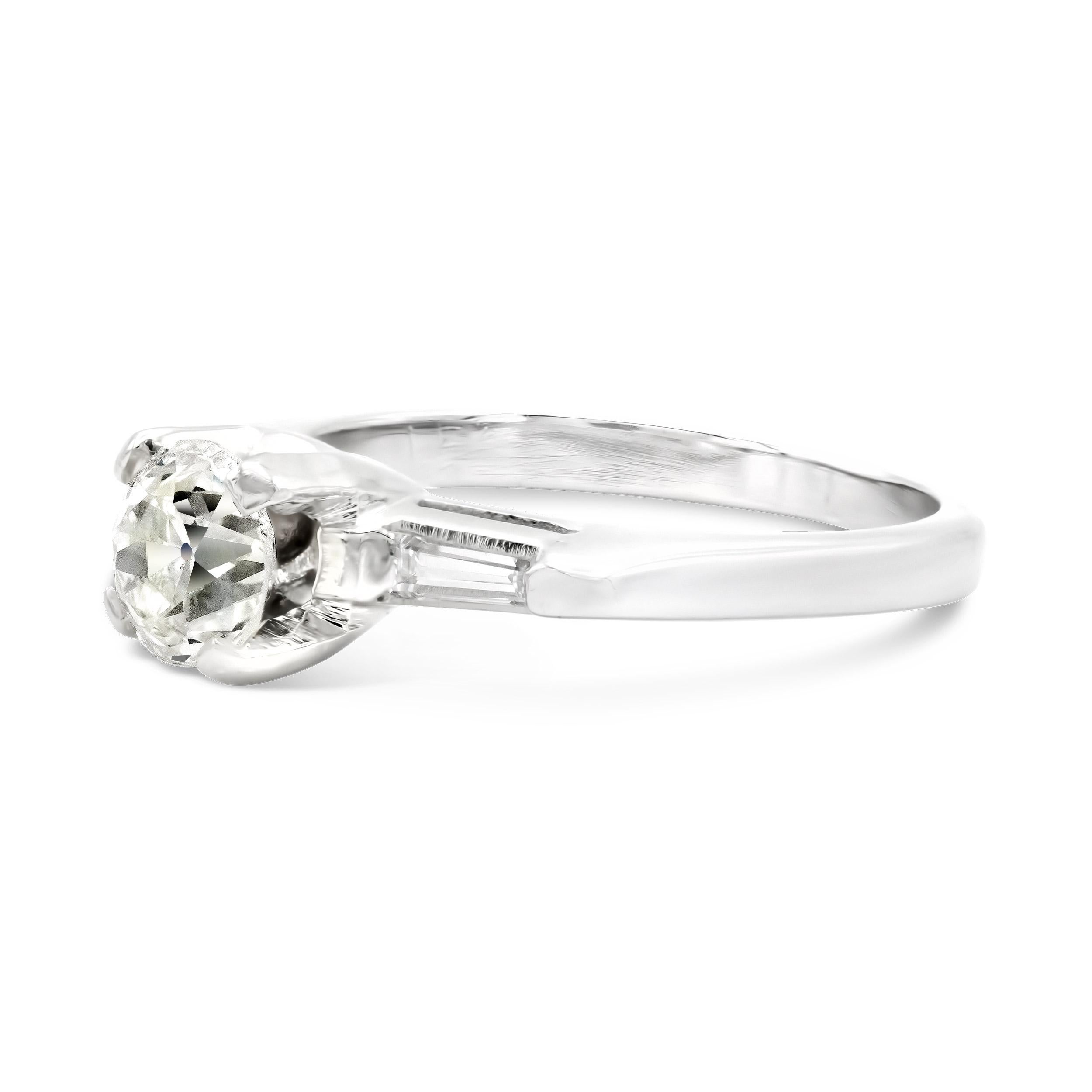 This art deco engagement ring setting is as sweet as it gets. It's centered by a 0.70 carat old European cut with an overall lovely look. Shouldered by classic tapered baguettes, this ring is pure elegance that will never go out of style.

Diamond