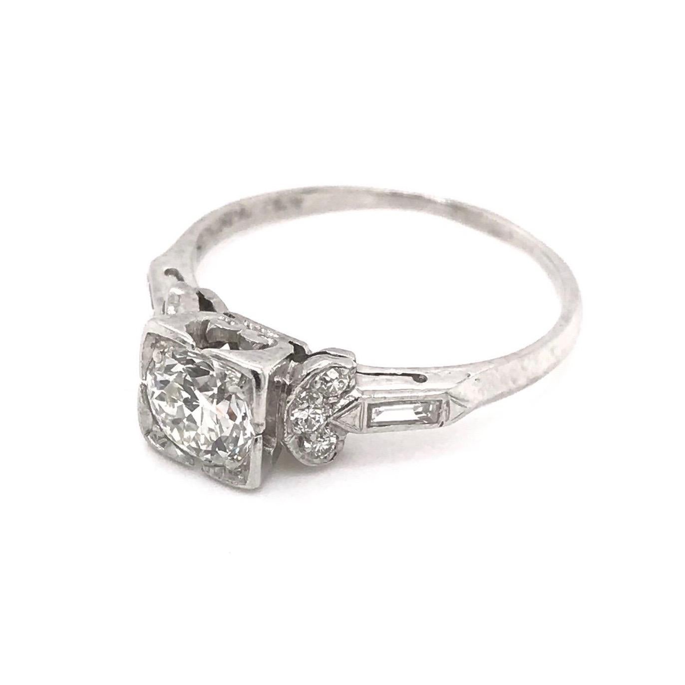 This ring was handcrafted sometime during the Art Deco design period ( 1920-1940 ). The setting is platinum and features a center diamond measuring approximately 0.75 carats. The center Old European Cut diamond grades approximately J in color, VS2