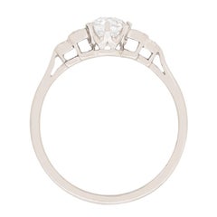 Art Deco 0.75 Carat Diamond Solitaire with Baguette Shoulders, circa 1920s