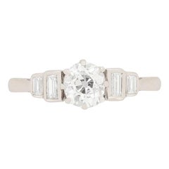 Art Deco 0.75 Carat Diamond Solitaire with Baguette Shoulders, circa 1920s