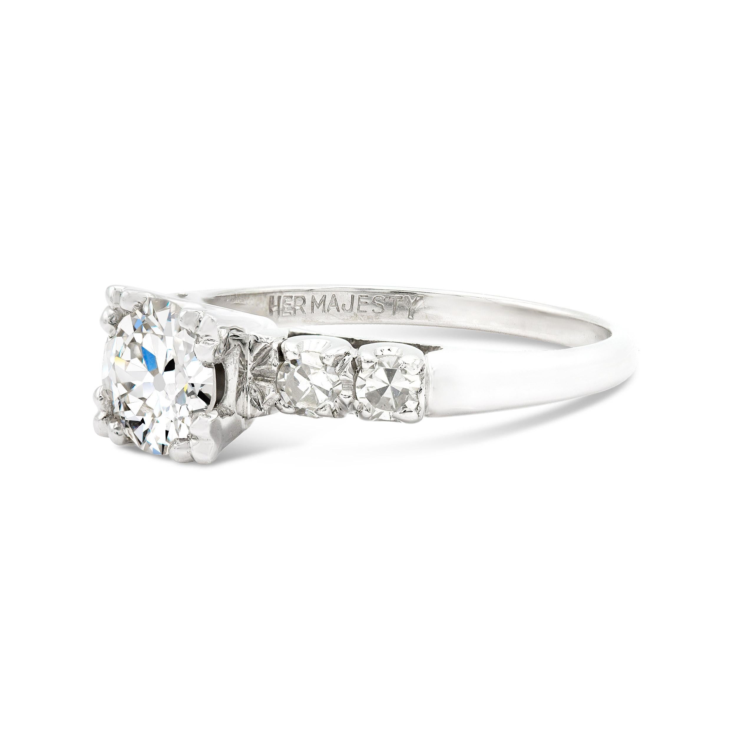 This piece holds a special place in our heart. An icy white antique cut center steals the show on the deco-era engagement ring. At 0.75 carats with a large table and wide open culet, we can't stop staring. The accenting diamonds are just as bright