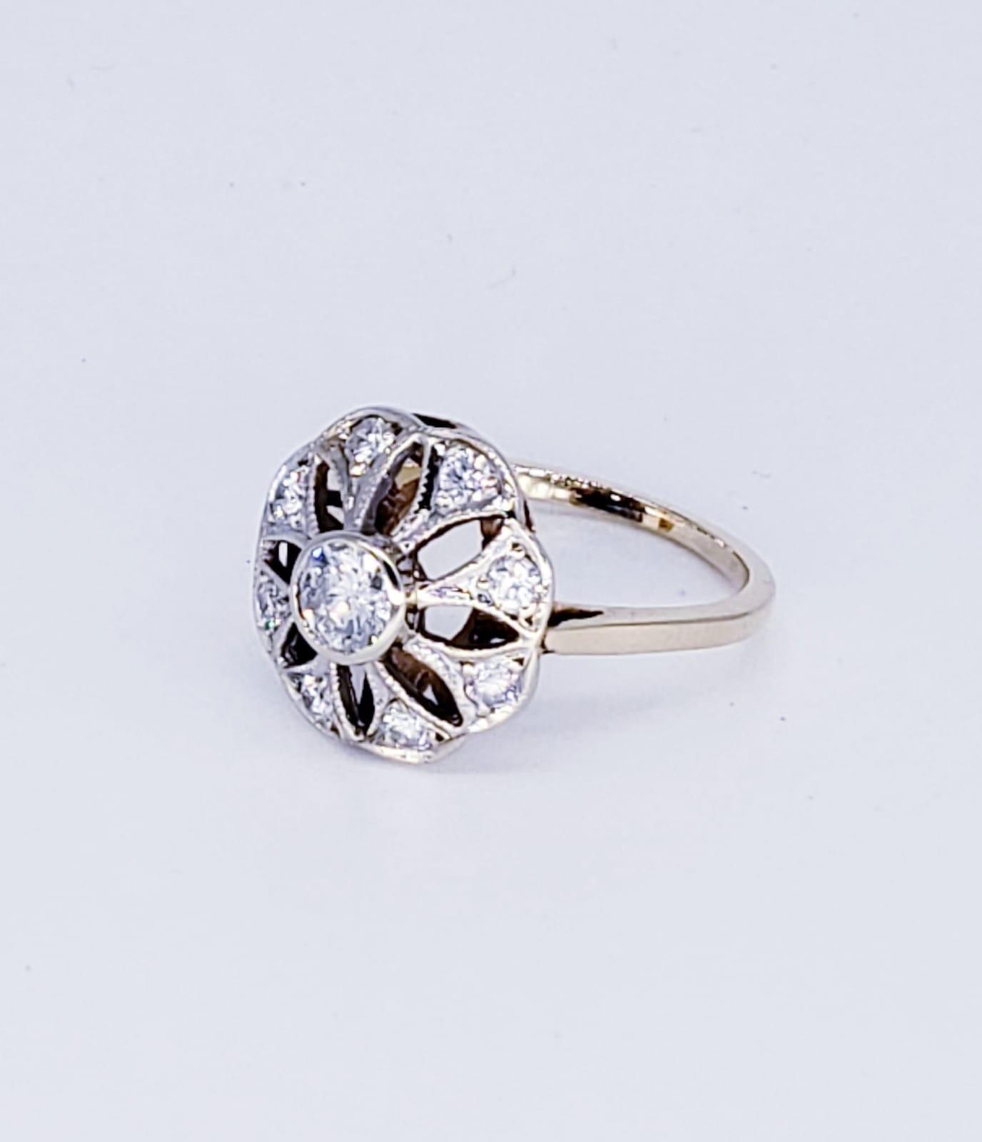 Art Deco Style 0.76 Carat Diamond Cocktail Ring. Center diamond is approx 0.36ct & surrounding diamonds weight a total of 0.40ct (8 stones 0.05ct each). The ring is a size 6.25 & weights 3.4 grams 14k solid gold. The height of the ring measures