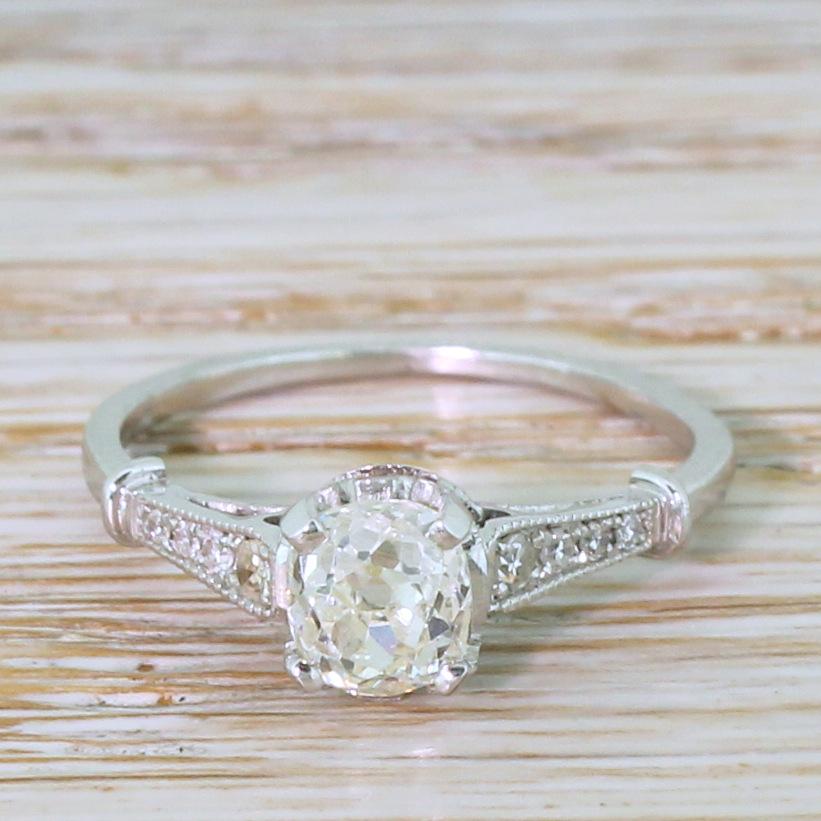 An unbelievable old cut engagement ring. The cushion shaped diamond in the centre is secured in a four claw collet with stunning geometric detailing in the gallery. Milgrained, reverse tapering shoulders are set with eight (four each side) eight-cut