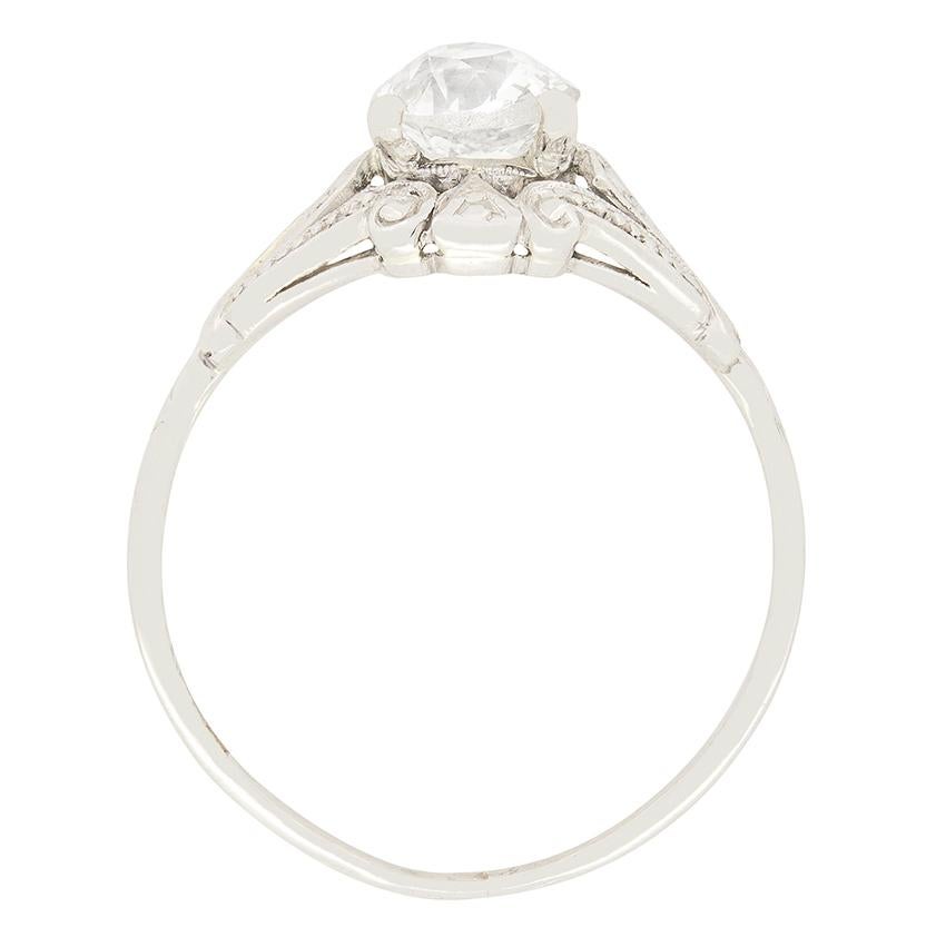 A captivating solitaire ring, crafted entirely in platinum, features an old cushion cut diamond claw set to the centre weighing 0.78 carat. The lovely diamond has been estimated as H in colour and SI1 in clarity. Surrounding the diamond is