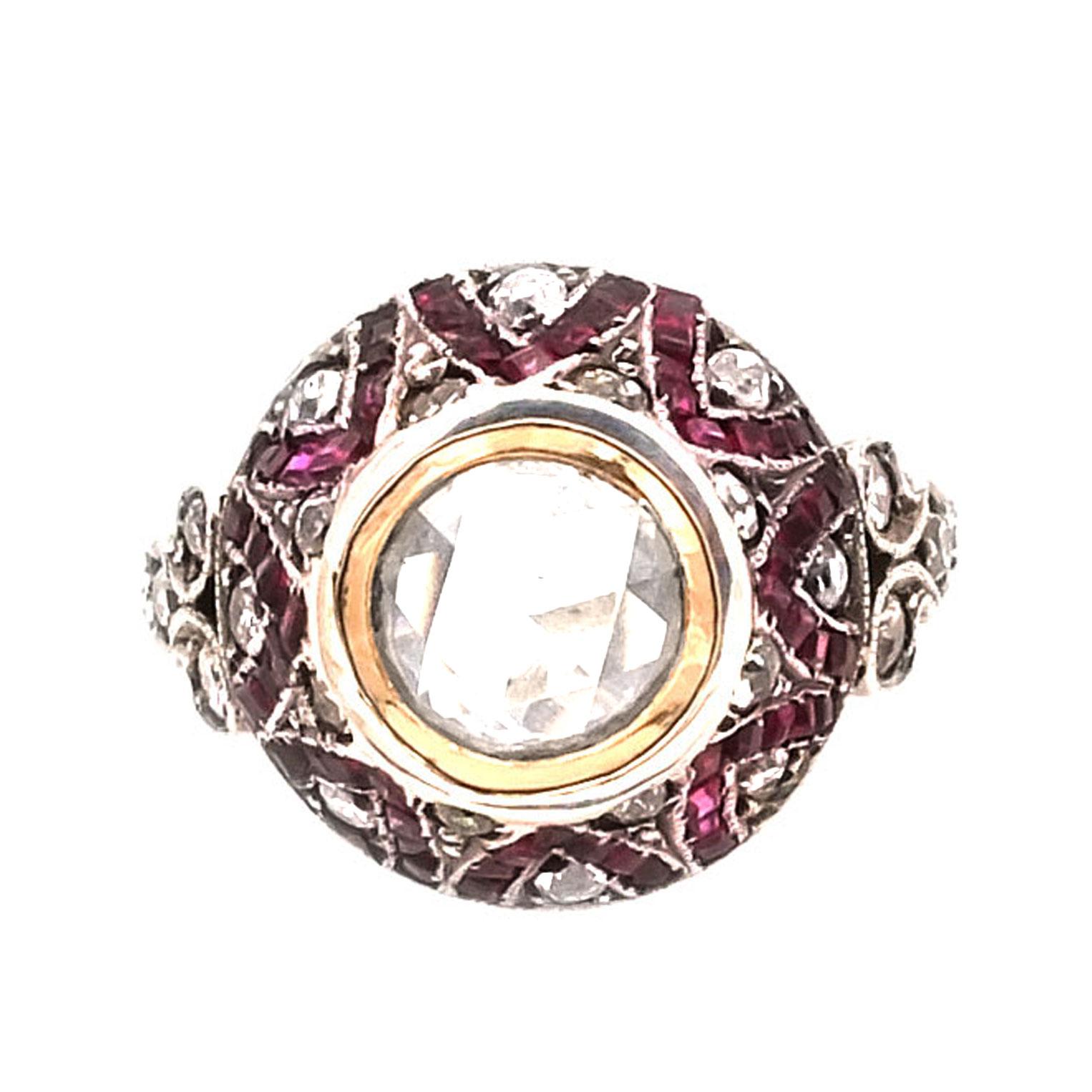 Art Deco 0.8 Carat Diamond Rose and Ruby Solitaire Ring, circa 1920

Attractive diamond ring set in the center with a shining diamond rose of 0.8 ct in a high bezel setting, which is pave set with rubies and diamond roses in an attractive zigzag