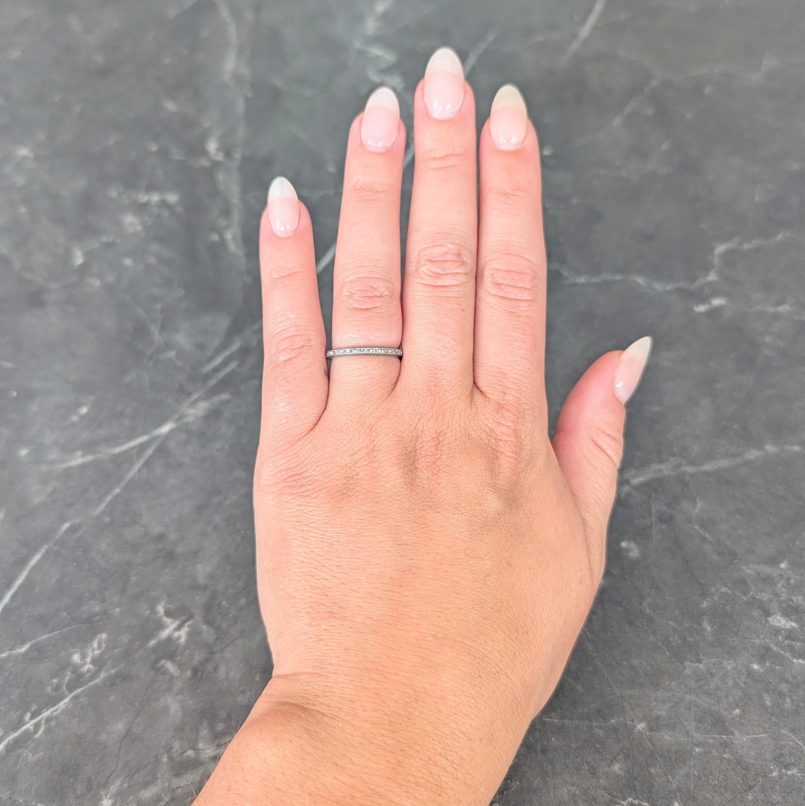 Featuring French cut diamonds channel set fully around
Weighing approximately 0.80 carat total
H/I color with VS2 to SI1 clarity
Accented by milgrain edges
Tested as platinum
Circa: 1930s
Ring Size: 5 3/4 and not sizable
Measures north to south 2.0
