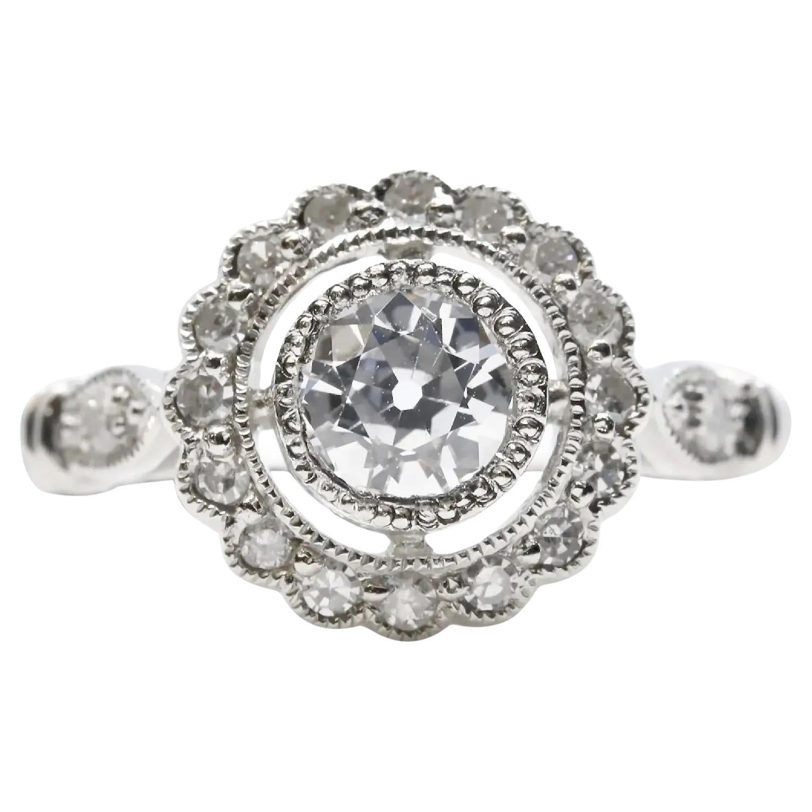 Art Deco 0.80ctw Diamond Halo Engagement Ring in Platinum For Sale