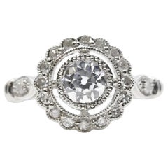 Antique Art Deco 0.80ctw Diamond Halo Engagement Ring in Platinum