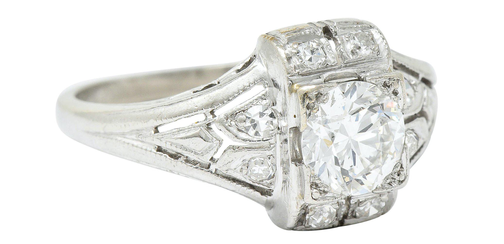 Dinner style ring with a rectangular center featuring a square form head

Set with a transitional cut diamond weighing approximately 0.65 carat; H color and VS2 clarity

Surrounded by single cut diamonds weighing in total approximately 0.20 carat;