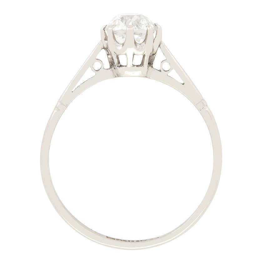This timeless solitaire dates back to the 1920s. Held within platinum claws sits a wonderful 0.91 carat old cushion cut diamond. The diamond has an estimated grading of H in clarity and SI1 in clarity. The open basketwork allows light under the