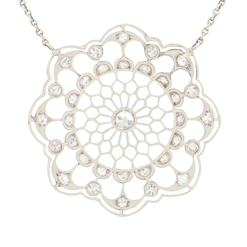 A beautifully intricate design, this necklace dates to the 1920s. A total of 0.92 carat of old cut diamonds are suspended in the delicate platinum webbing. The centre diamond is 0.20 carat, with 0.72 carat of diamonds surrounding. The diamonds all