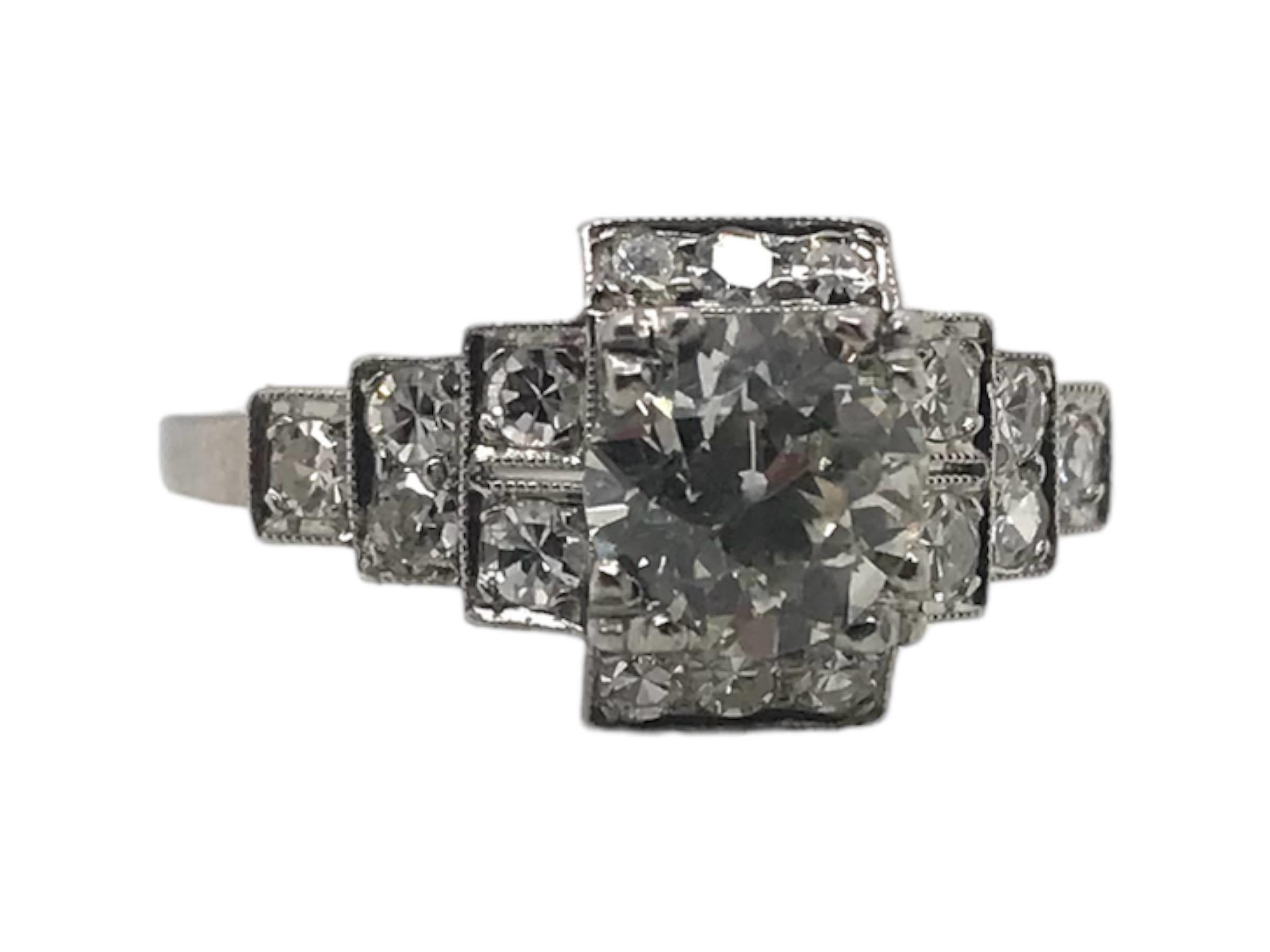 Simply stunning!! 
This Beautiful Art Deco Era, 1920 - 1940, platinum engagagemenent ring features a lovely 0.95 Carat Old European Cut Diamond, M Color, SI1 Clarity. 
The center stone sits nice & low to the finger. Accenting the center stone are 16