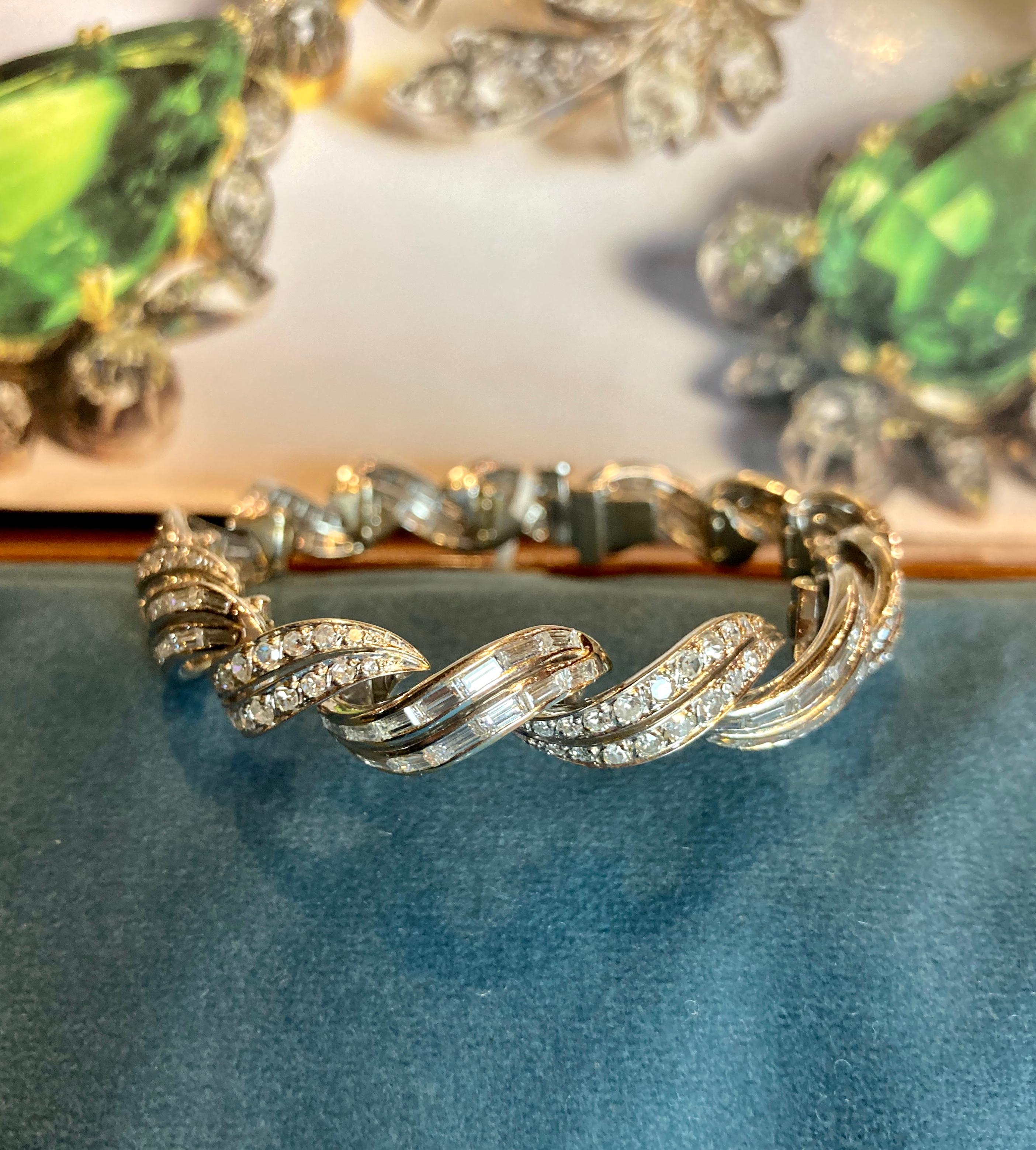 A beautiful Art Deco bracelet featuring 10 carats of round brilliant and baguette cut diamonds mounted in 18 karat white gold. Measures 6.5 inches long. Made in France, circa 1920s.