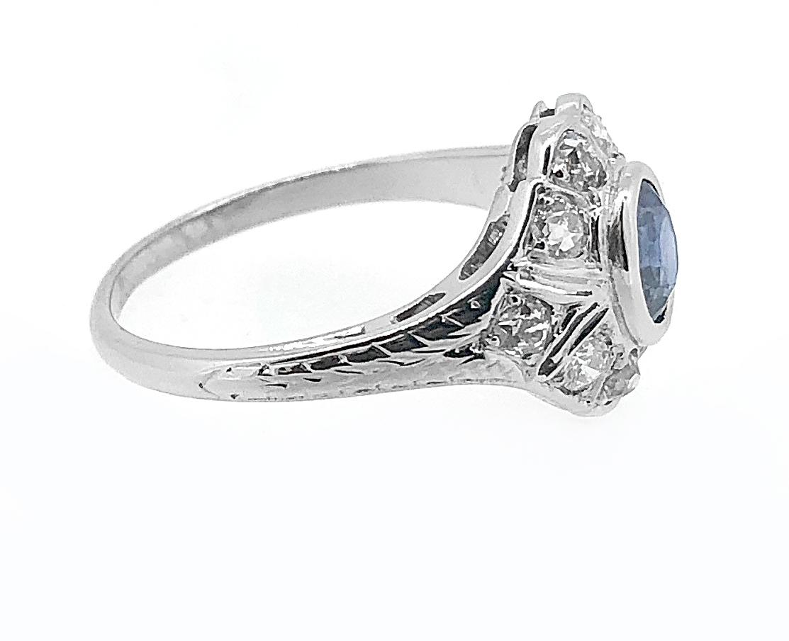 A delighful 18k White Gold Art Deco diamond & sapphire Antique engagement or fashion ring features 1.00ct. apx. T.W. of natural blue oval cut sapphires & 1.00ct. apx. T.W. of European cut diamonds with VS2-SI1 clarity and G-H color. Exceptional
