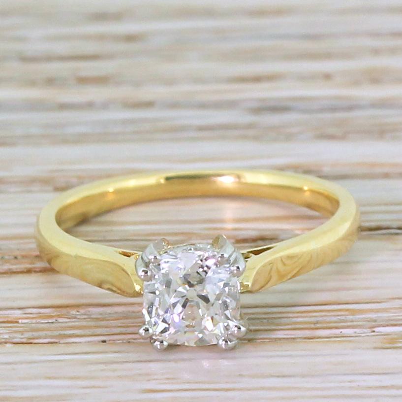 Such class. The old mine cut diamond – graded by HRD as H colour, SI1 clarity – is dazzlingly bright and white. The stones is secured by four split claws in a platinum collet with pretty curved detailing in the gallery, which sit and a slim and