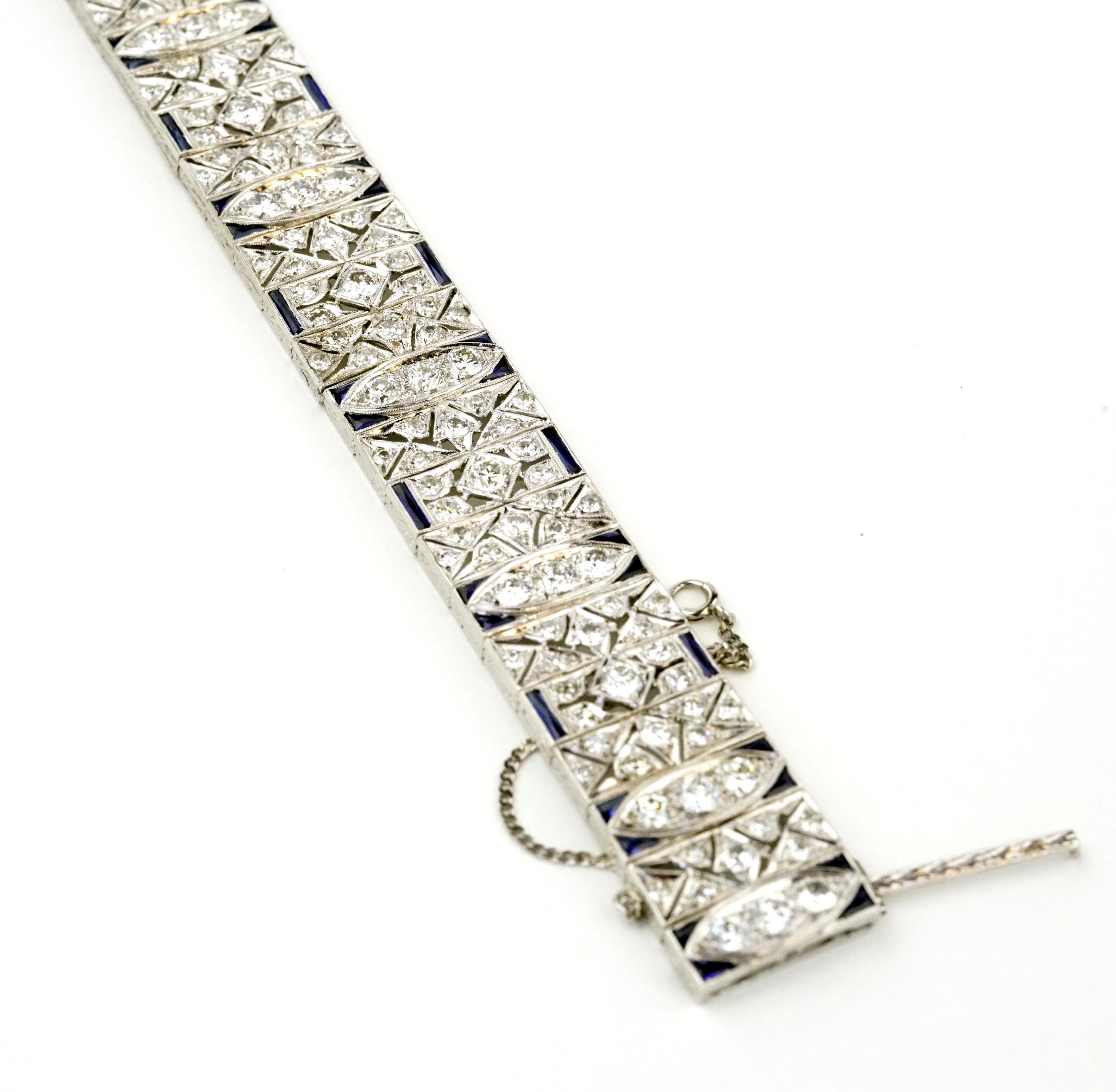 Original Hand Made Art Deco 1930's Diamonds and Sapphires Extremely Rare Bracelet.
Stunning 10.01 Carats total of natural old European cut and single cut diamonds E-F in color , VS1-2 clarity . The diamonds accented along with natural baguette cut