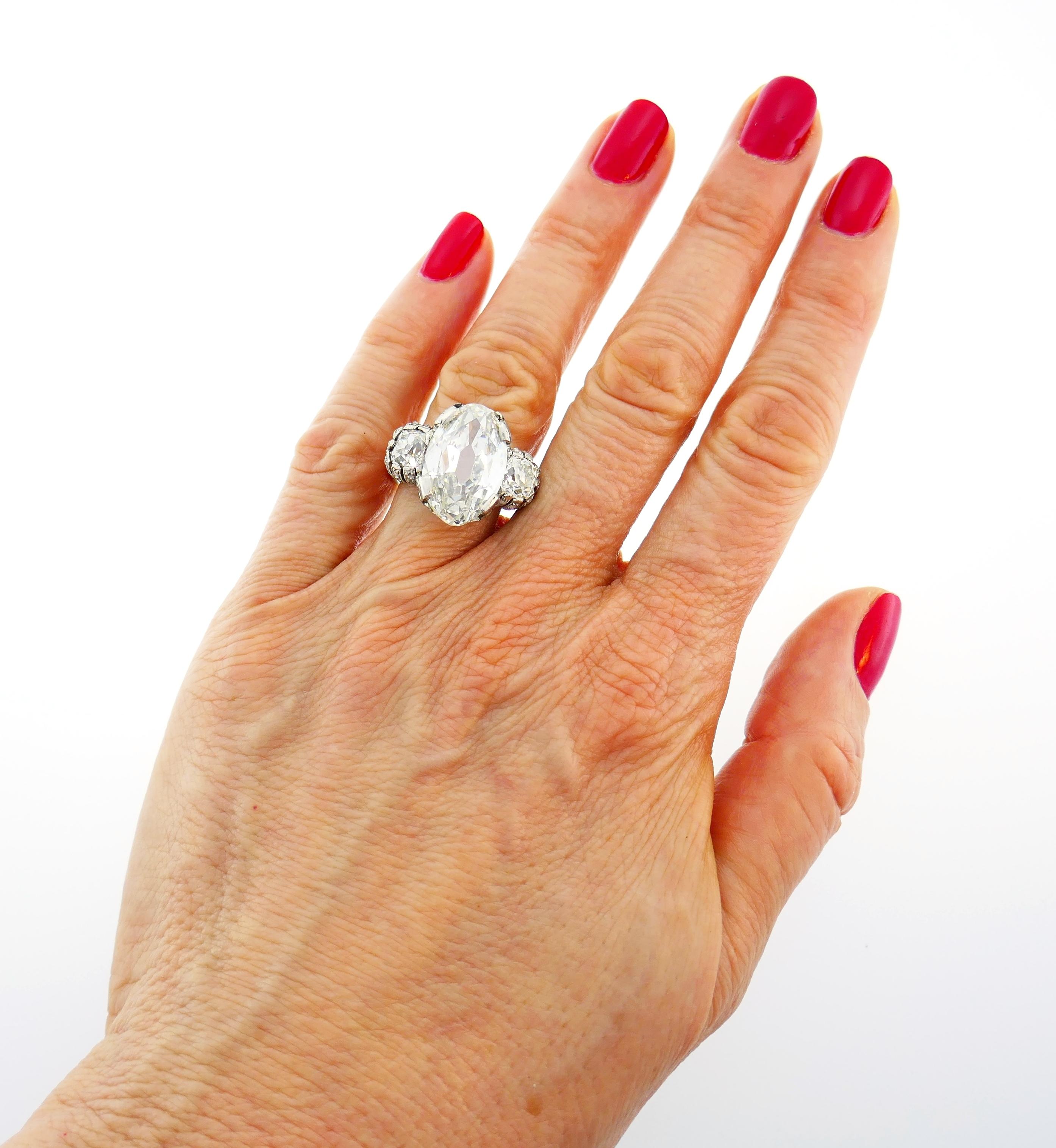 Magnificent, one-of-a kind Art Deco diamond ring! Features a 10.03-carat old oval brilliant cut diamond set in platinum and flanked by two old-mine cut diamonds. The center diamond comes with a GIA Diamond Grading Report stating that it is of I