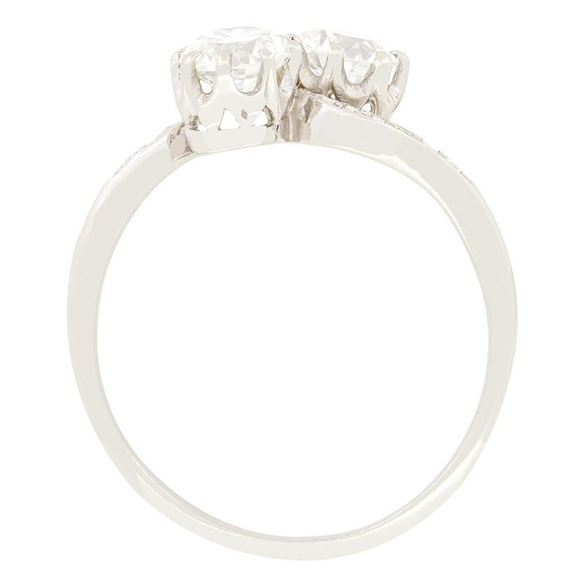 A pair of beautiful old cut diamonds take centre stage in this 1920s twist ring. Both diamonds match perfectly in both size and quality, with each being 0.50 carat with a colour of G and clarity of VS2. Each diamond has been claw set into platinum