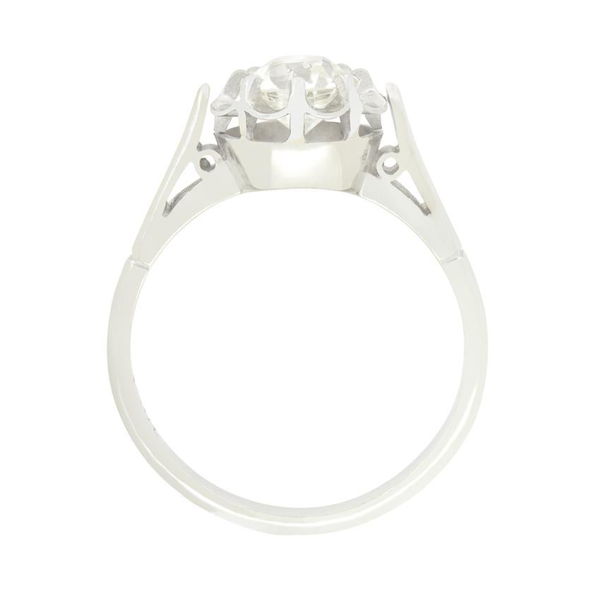 This beautiful Art Deco ring dates back to the 1920s with the 1.02 carat old cut diamond is set in a delicate petal like mount, creating a subtle illusion of a bigger diamond. Estimated J in colour and VS1 in clarity the stone, is set within an 18