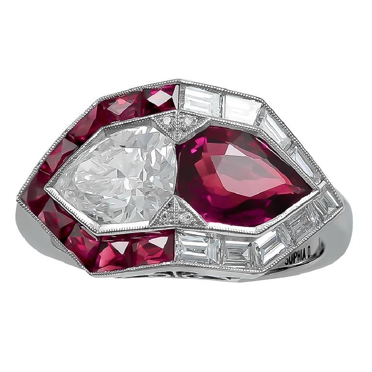 Platinum Art Deco Style Ring with pear shaped ruby center weighing 1.02 carat and pear shaped diamond weighing 0.70 carat. Ruby side stones total weighing of 0.40 carat and diamond side stones with the total weight of 0.36 carat ring. 


           