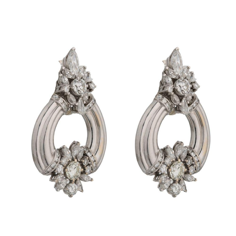 Antique art deco earrings featuring 10.3 carats of diamonds, set in platinum, with 1.25 old European carat  centers.
Diamond Details
Shape	Old European
Color 	I 
Clarity 	VS1 
Weight 	10.2 Carats Total Weight (1.25 each center)
 
Earring