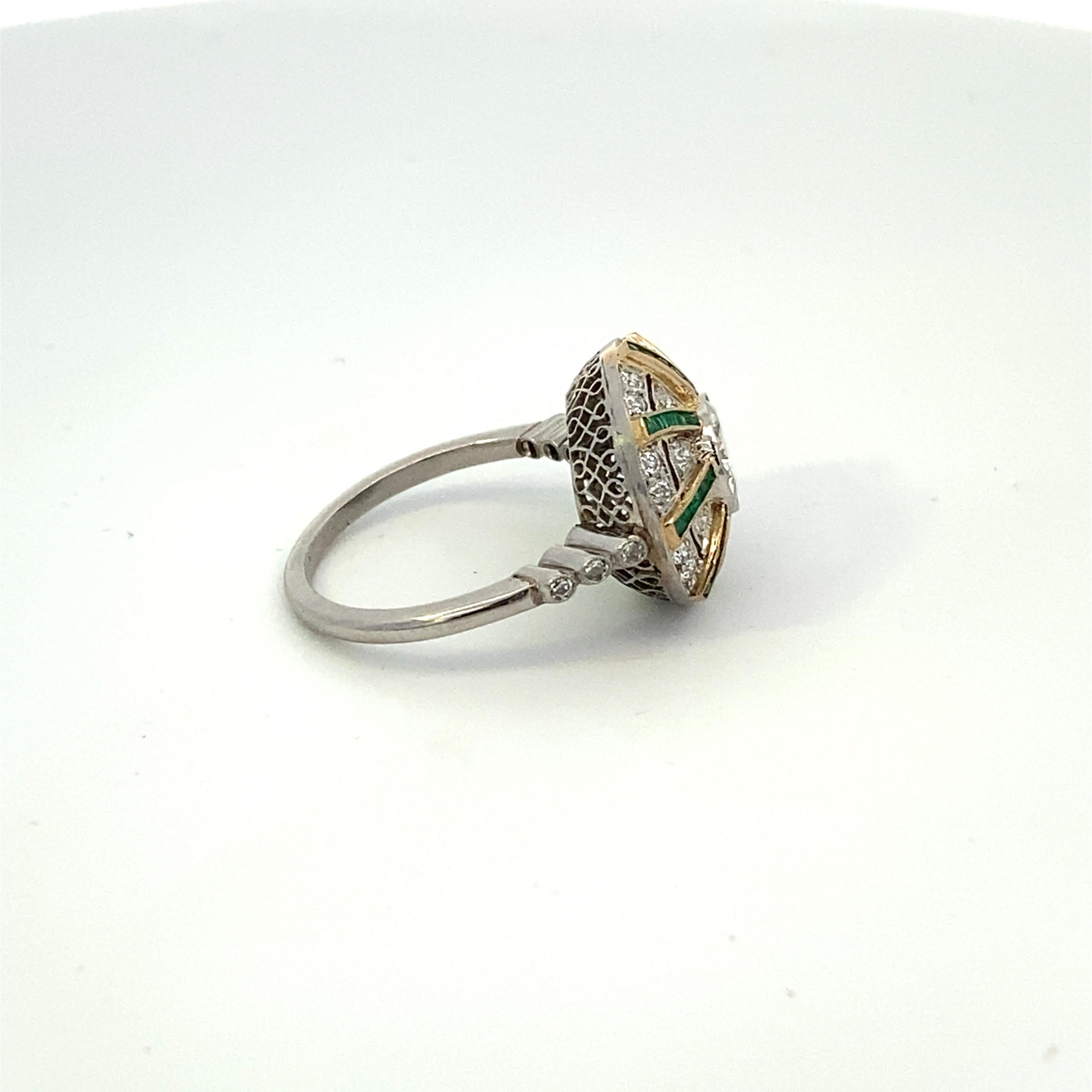Art Deco platinum ring with 1.04 carat Old European Cut center diamond and 1 carat total weight emeralds and .90 carat total weight diamonds. Size 7 US