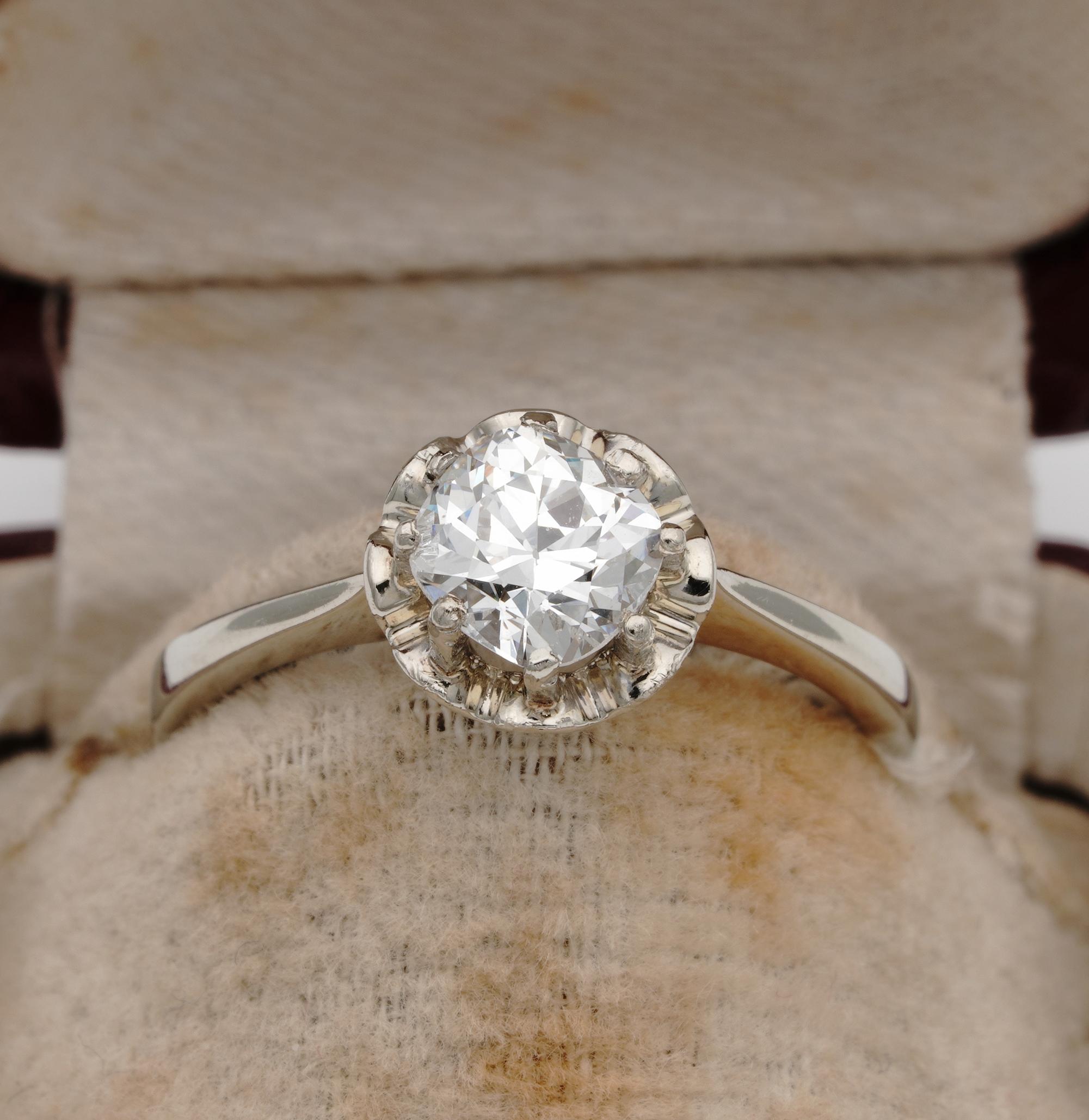 This classy late Art Deco Diamond solitaire ring is 1930 ca
Traditional flower head mount with plain shank exquisitely hand made of solid 18 Kt gold
Center Diamond is a bright white full of sparkle old European cut rather cushion in cut, it is a