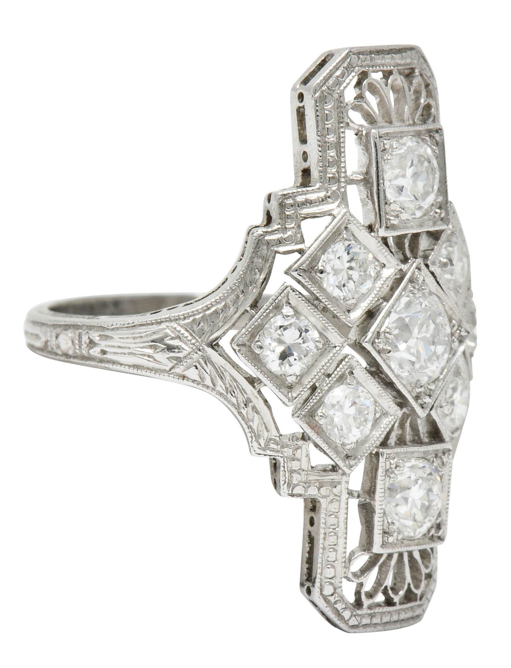 Dinner style ring with geometric forms and a pierced trellis design

Forms are tri-bead set with transitional cut diamonds with the center weighing approximately 0.27 carat

Additional diamonds weigh in total approximately 0.78 carat; all feature G
