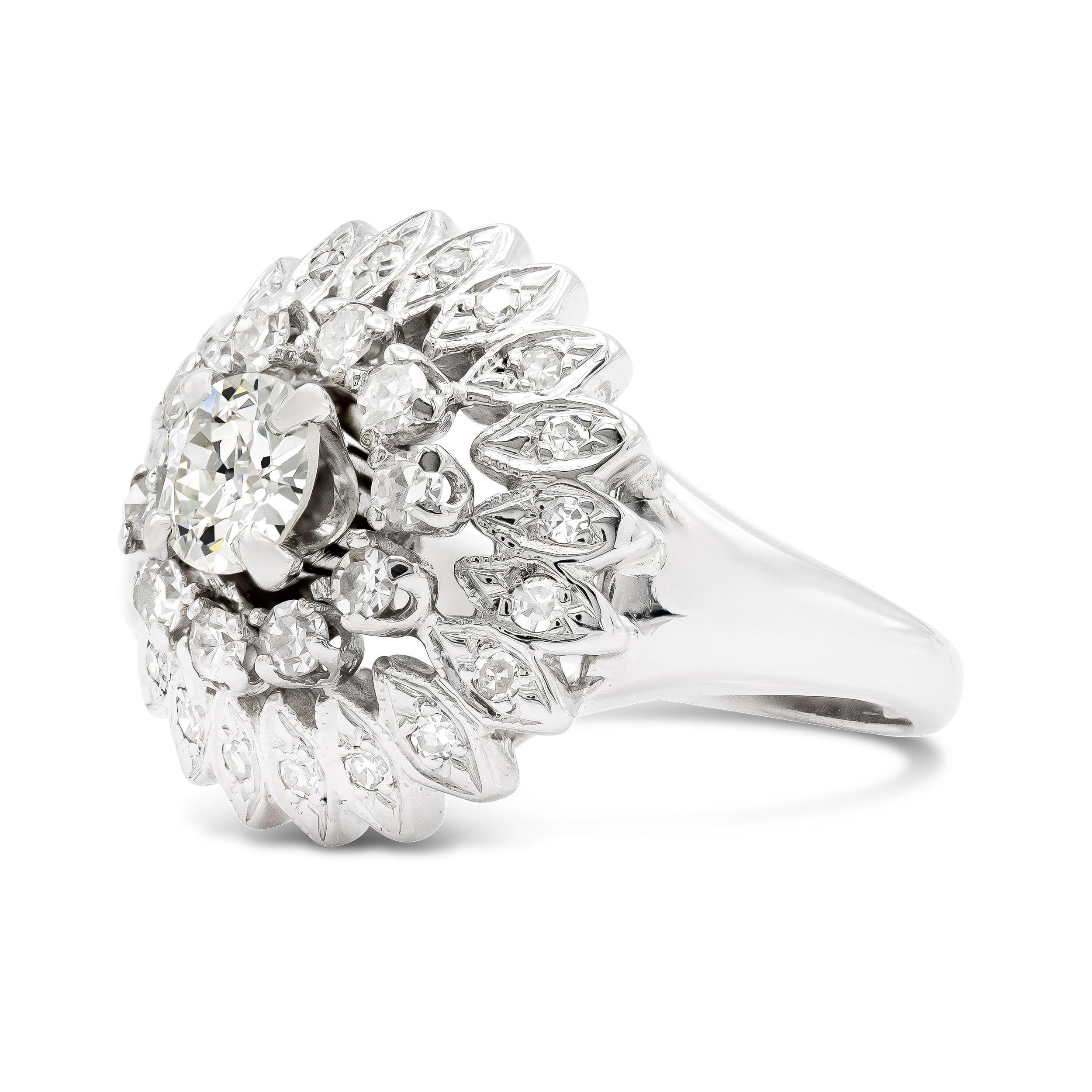 Here's an art deco cluster ring that stands out. Its sparkling tiered design is topped with a half-carat old European cut diamond that shines bright, set among graduated single cuts in 18kt white gold. We love the marquise metalwork accents and all