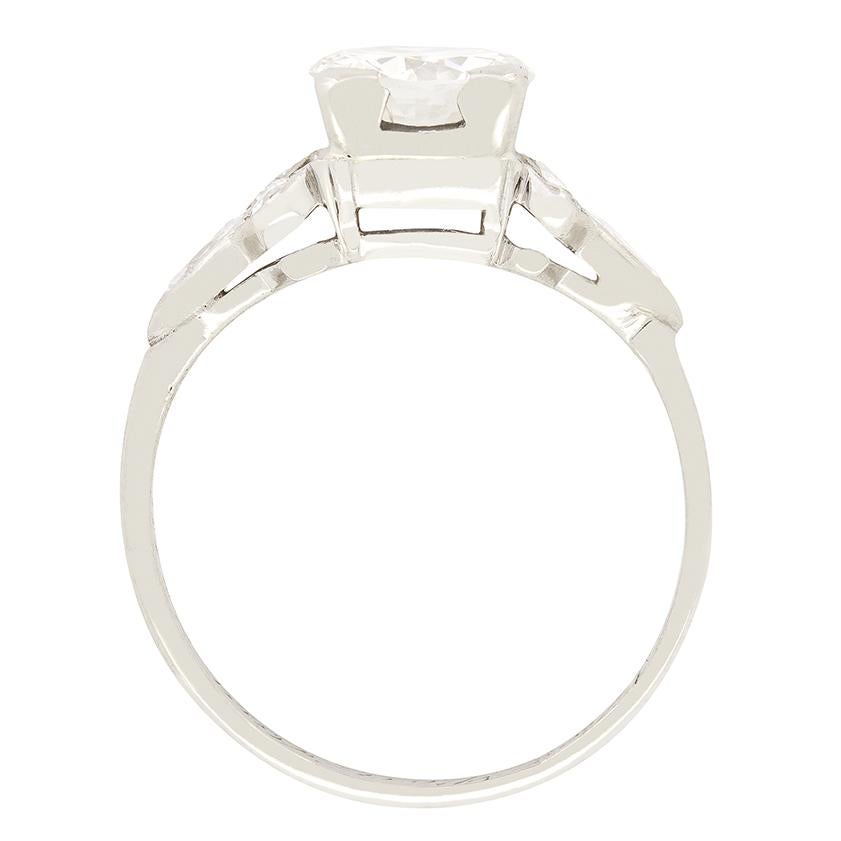 This classic solitaire ring radiates timeless Art Deco style. A 1.05 carat transitional cut diamond is star of the show. The diamond has a colour of I and a clarity of VS1 and is corner claw set. into the platinum mount. Intricate split shoulders