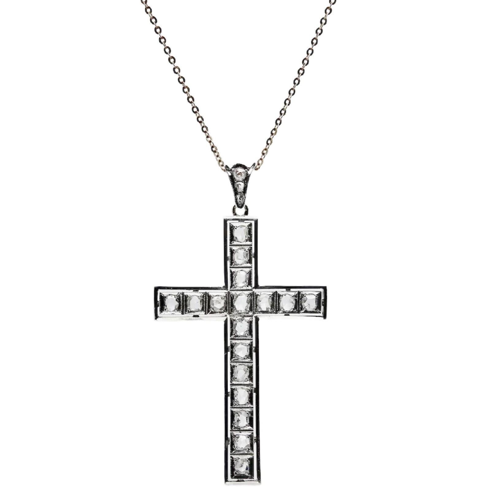 An antique Art Deco period rose cut diamond cross in platinum and 14 karat yellow gold. Set throughout this beautiful cross are a total of 20 G color, VS clarity antique rose cut diamonds. Weighing a combined 1.05 carats total weight the diamonds
