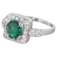 Art Deco 1.08 Carat Emerald and 0.42 Carat Diamond Platinum Cluster Ring