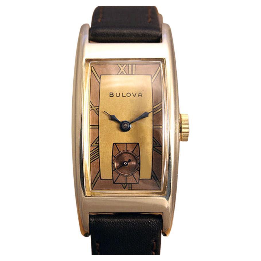 For your consideration is this very stylish gents 10k Rolled Gold wristwatch, made Bulova and dates to 1943. In superb condition with stainless back free from engravings. Unusual two tone dial is lovely original condition. We've had this watch