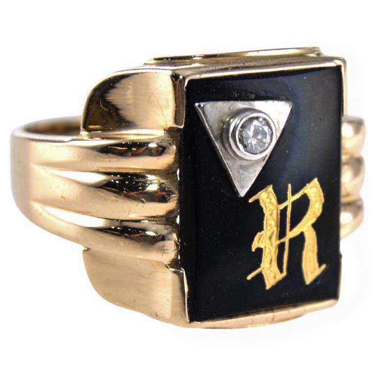 UNISEX RING
STYLE / REFERENCE: Art Deco
METAL / MATERIAL: 10Kt. Solid Gold
CIRCA / YEAR: 1930's
CENTER STONE / WEIGHT: Onyx with 3Pt. Diamond inset
SIZE: 10.25  

Crafted in 10K Solid Yellow Gold, this architectural beauty is set with a genuine Onyx