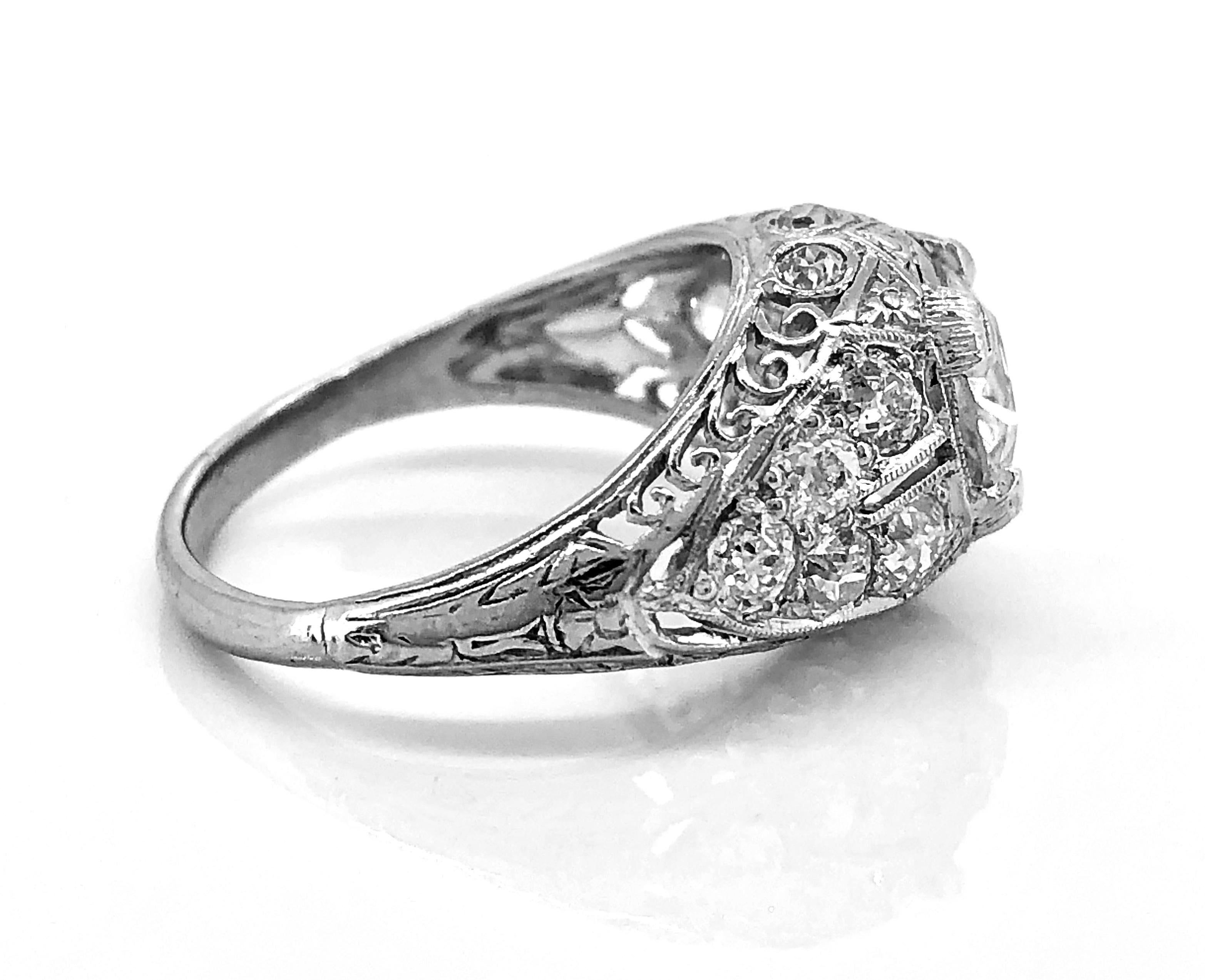 A breathtaking late Edwardian/early Art Deco diamond Antique engagement ring features a 1.10ct. apx. European cut diamond with SI2 clarity and H color. This stunning ring is accented with .70ct. apx. T.W. of European cut diamonds with VS-SI clarity