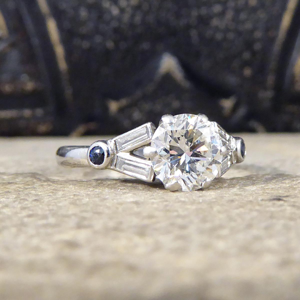 This ring would make the perfect engagement ring for anyone who like an 1920's pre loved piece. It is Early Generation Brilliant Cut Diamond weighing 1.10ct in a 6 claw setting. Showing its classic Art Deco style with Baguette Cut Diamond creating a