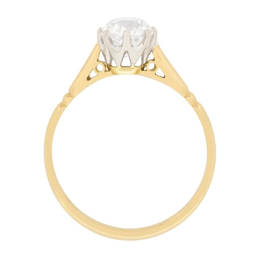 A lovely 1920s engagement ring featuring a 1.10 carat old cushion cut diamond. The diamond is H colour and VS1 clarity. It would have been cut by hand, and is securely held by platinum claws. The shank is crafted of 18 carat yellow gold, which has