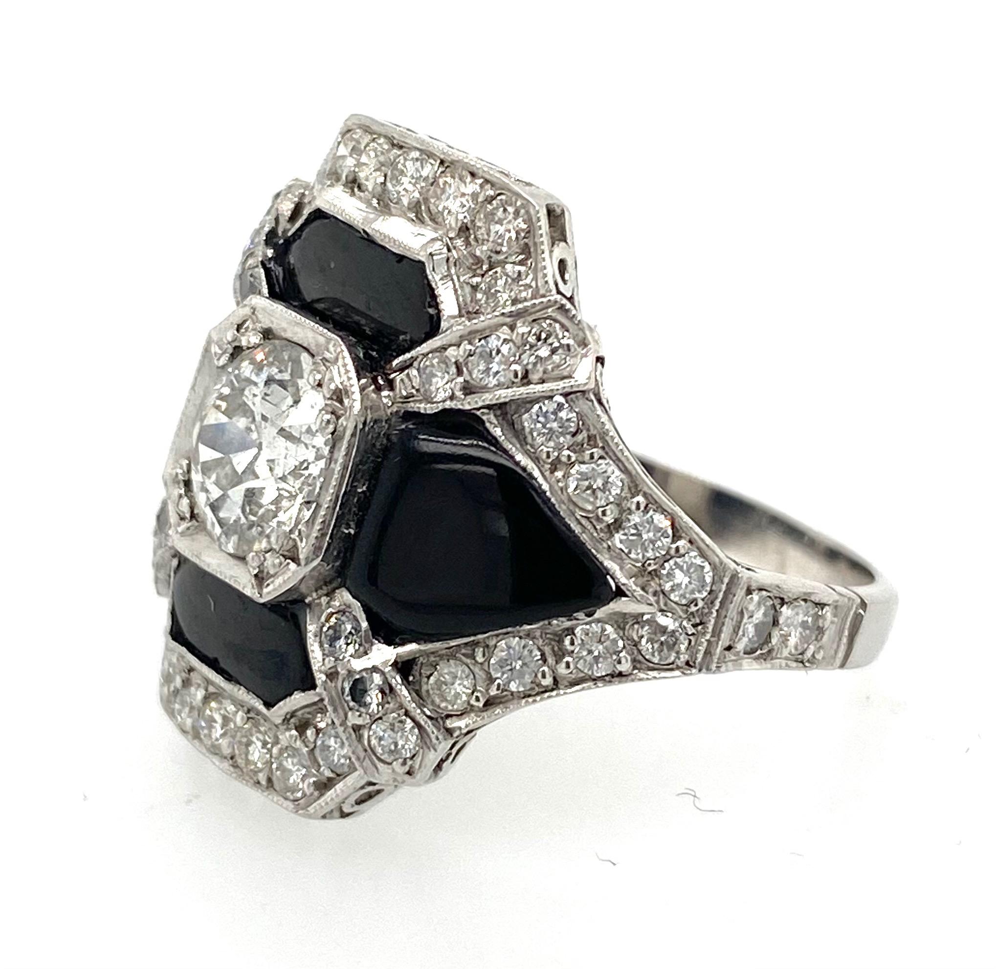 This Art Deco ring is a stunning example of vintage jewelry. The ring features a gorgeous 1.10 carat Old European Cut diamond in the center, which is surrounded by 1.38 carats of dazzling diamond accents. The diamonds are set in a Pt900 (platinum)