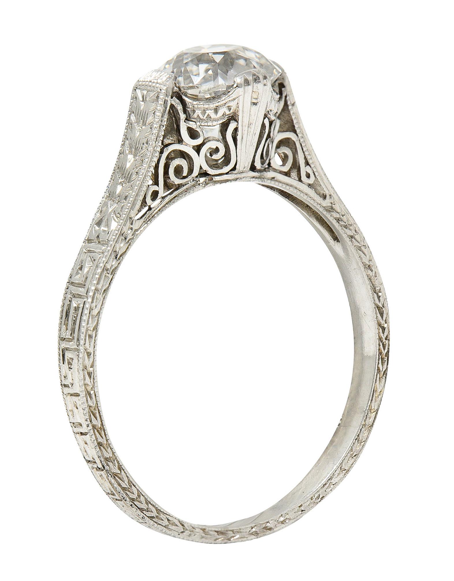 Centering an old mine cut diamond weighing 1.15 carats - H color with SI2 clarity

Set by wide prongs with a scrolled volute gallery

Fully engraved shank with foliate and Greek key motifs - accented by milgrain

Stamped Platinum

Circa: 1930s

Ring