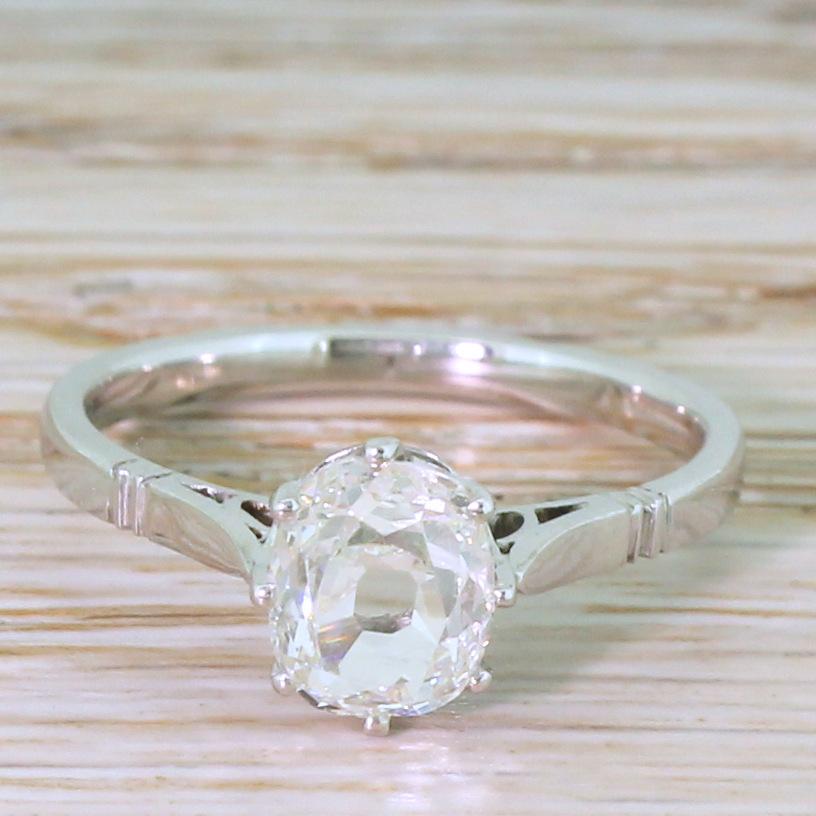 A glorious old mine cut diamond from the early part of the 19th century. This early Victorian / Georgian oval shaped diamond has a luminous, glowing quality, and is showcased in a stunning, handmade white gold coronet which leads to a slim, D-shaped